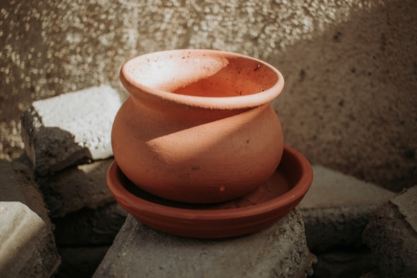 Unglazed clay pot. Photo by Vaness Dyste on Unsplash