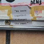 Sticker on wall, "We were together. I forget the rest." Photo by Compagnons on Unsplash.