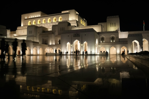 Exterior of the Royal Opera House Muscat at night. Photo by Daniele Levis on Unsplash