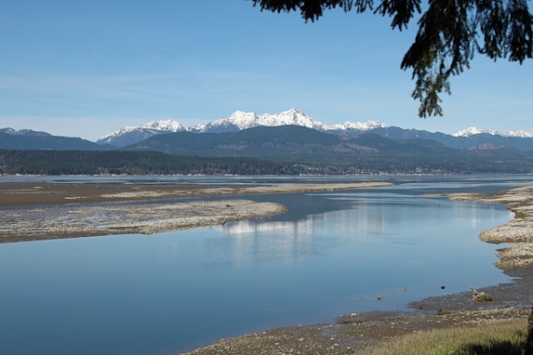 Mountains behind canal. Photo by Robert Bottman